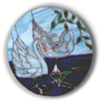 Picture of Arnie Garinger's stained glass work of art, Swans oval plaque.